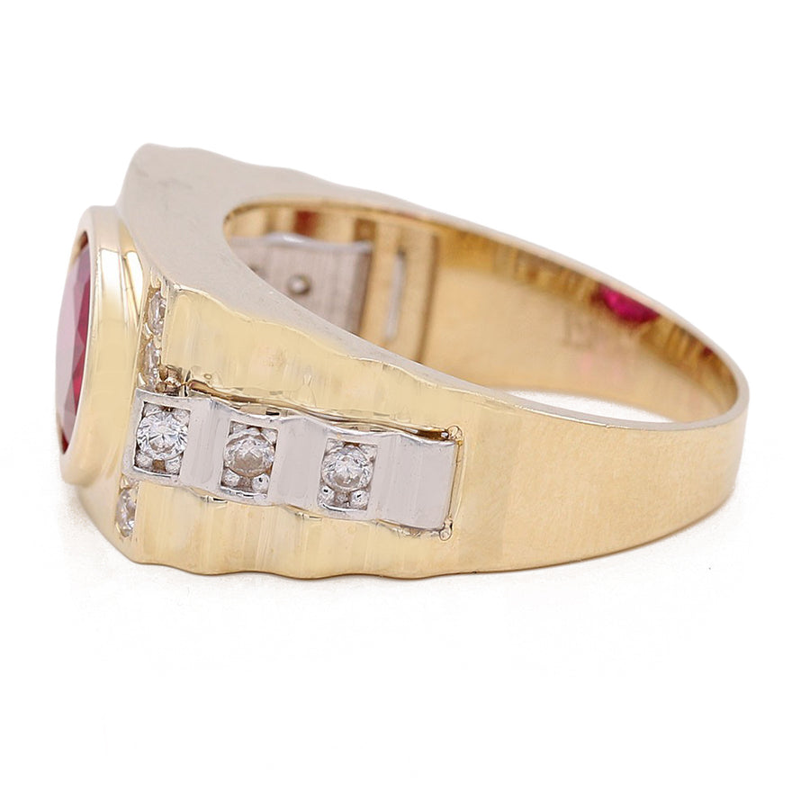 A Miral Jewelry yellow gold 14k fashion ring with a red CZ stone and diamonds.