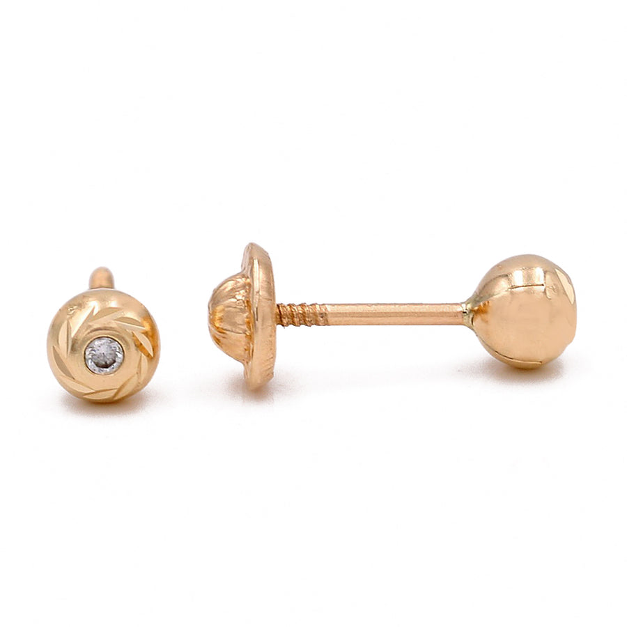 A pair of Miral Jewelry kid's 14k yellow gold balls earrings with CZ.