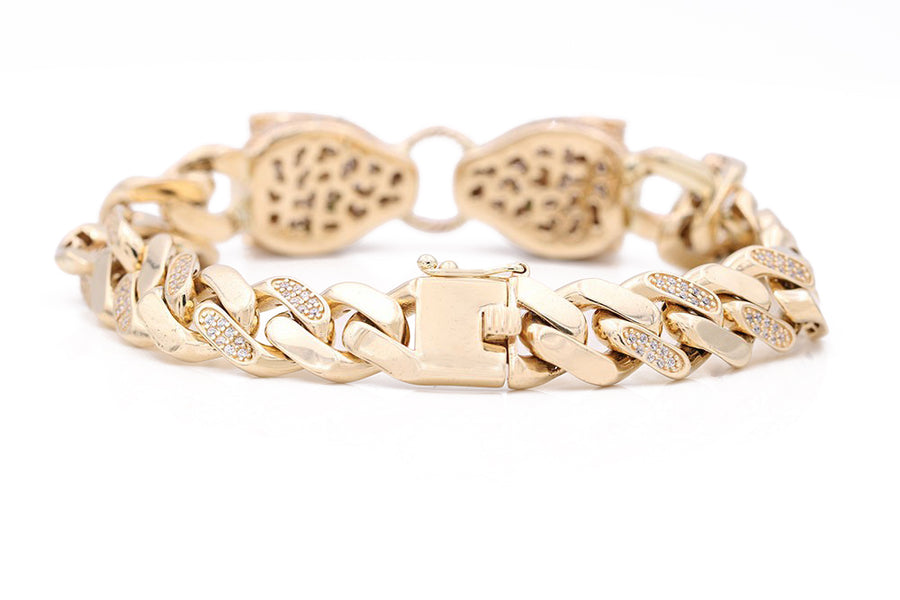 A Miral Jewelry Yellow Gold 14k Fashion Bracelet with a diamond clasp.