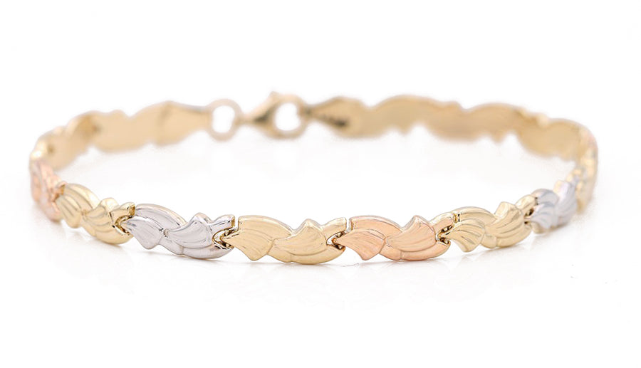 A Tri Color Gold 14k Fashion Bracelet with a leaf design, perfect for fashion-forward women by Miral Jewelry.