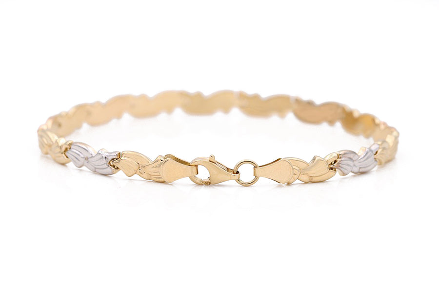 A Tri Color Gold 14k Fashion Bracelet adorned with two hearts, perfect for women from Miral Jewelry.