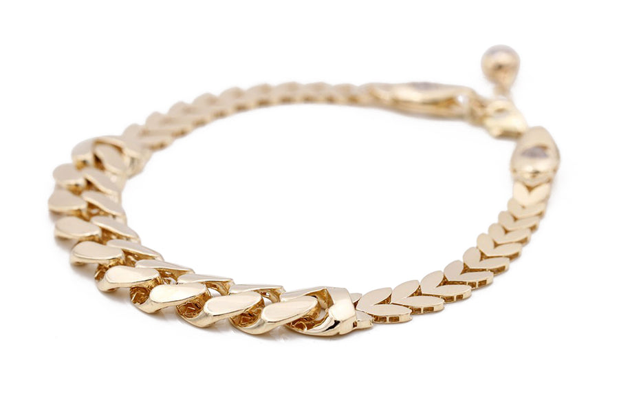 A Miral Jewelry women's yellow gold 14k Fashion Italian bracelet with CZ and an oval clasp.