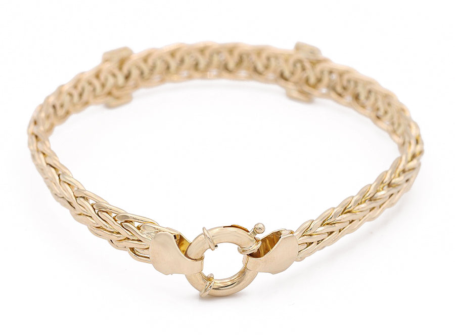 Yellow Gold 14k Fashion Bracelet With Cz by Miral Jewelry with a braided design and a toggle clasp, presented on a plain white background.