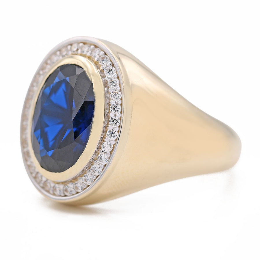A Miral Jewelry yellow gold 14k fashion ring with a blue sapphire and diamonds, perfect as a fashion ring.
