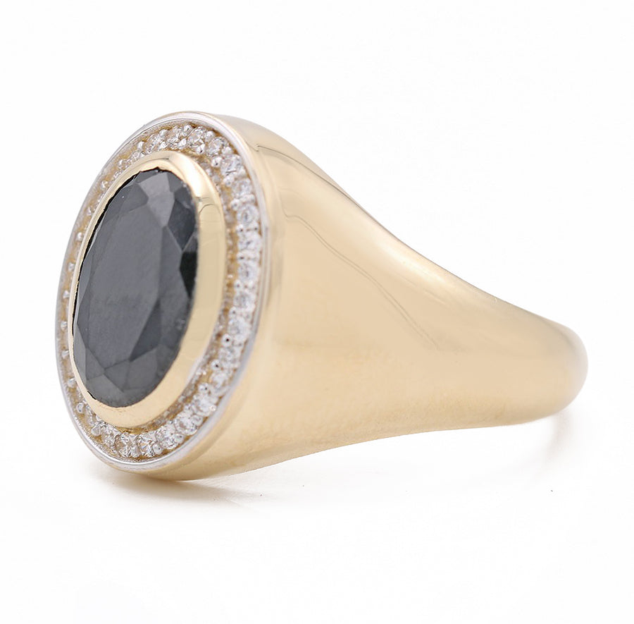A Miral Jewelry yellow gold 14k fashion ring with onyx and diamonds.