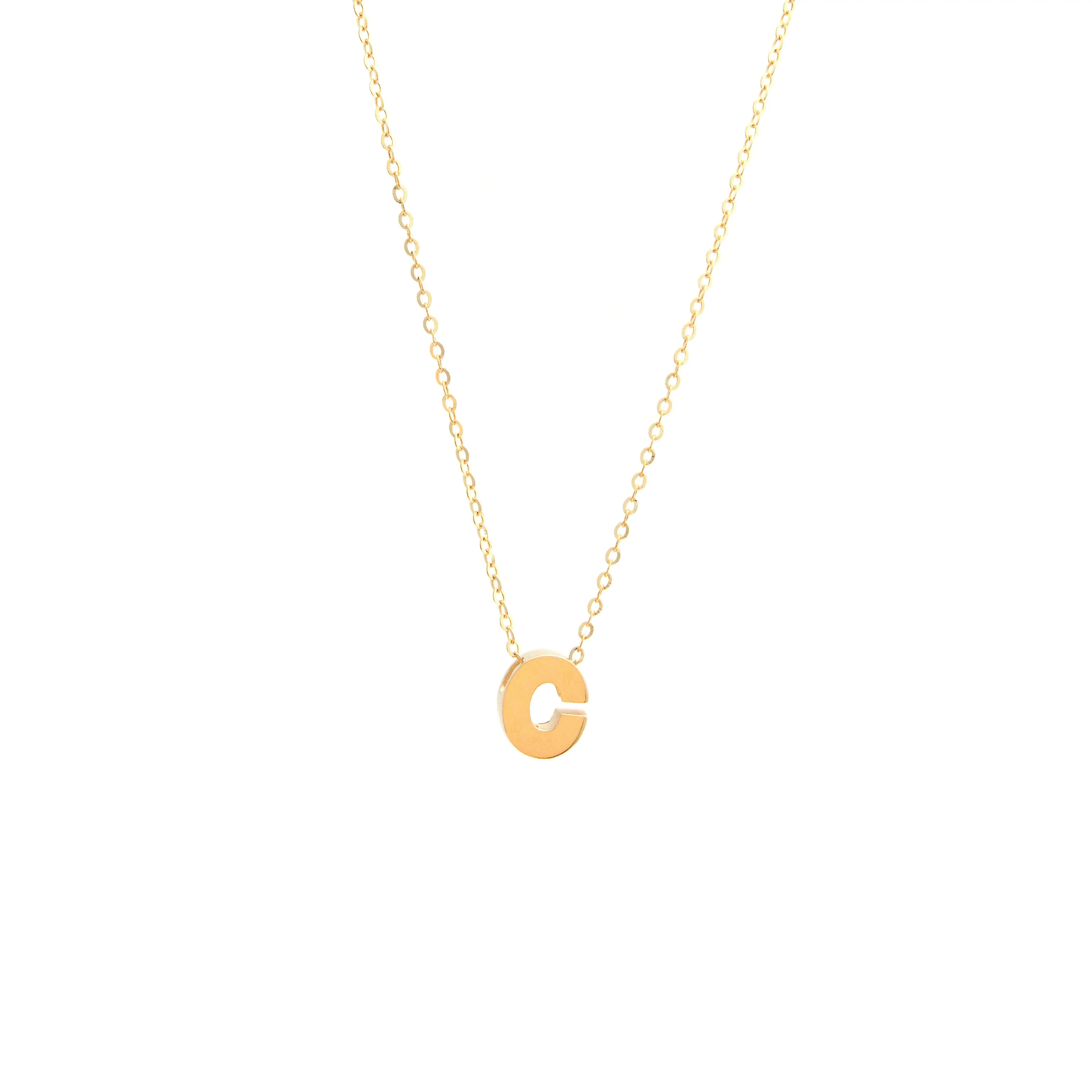 Initial C in 14k Yellow Gold Necklace from Miral Jewelry on a white background.